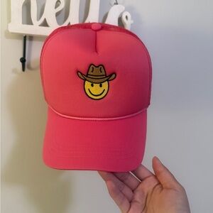 Neon pink smiley face hat